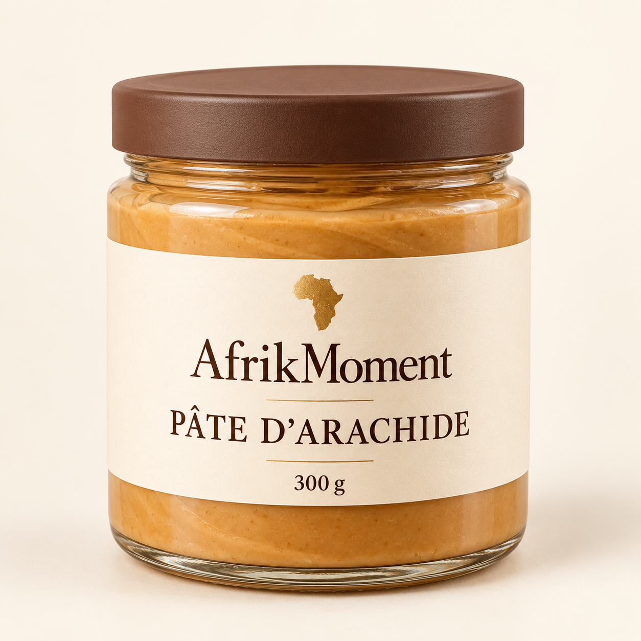 Visuel illustratif du pot AfrikMoment de pâte d’arachide de 300 g, avec étiquette crème et brune.